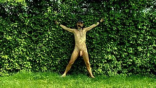 naked uncut, unmasked male slave exposed during outdoor party